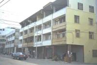 Street front building with arcade at the first floor (contemporary construction)