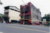 Street front building with arcade at the first floor (contemporary construction)