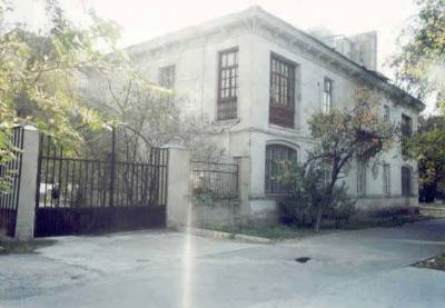 Two-story unreinforced brick masonry building with wooden floors