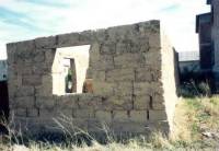 Houses with mud walls and thatch roofs 