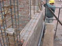 Base isolation of confined masonry