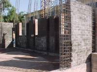 Base isolation of confined masonry