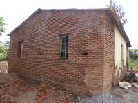 Unreinforced masonry houses made of fired clay bricks