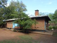 Unreinforced masonry houses made of fired clay bricks