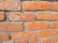 Unreinforced masonry houses made of fired clay bricks