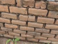 Unreinforced masonry houses made of fired clay bricks