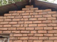 Unreinforced masonry houses made of fired clay bricks