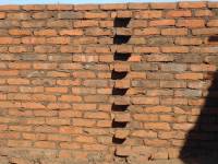 Unreinforced masonry houses made of fired clay bricks